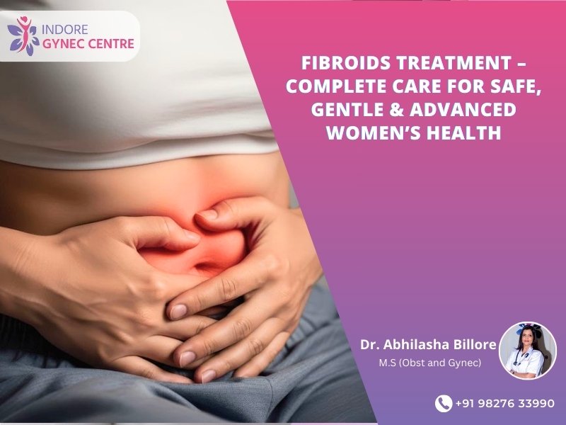 Woman experiencing lower abdominal pain due to fibroids, highlighting Fibroids Treatment in Indore by Dr. Abhilasha Billore at Indore Gynec Centre.